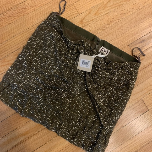 Haute Hippie mini Skirt
Olive and Gold
Bead Embellishments
Zip Closure - Picture 2 of 3